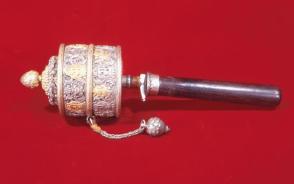 Buddhist hand prayer wheel