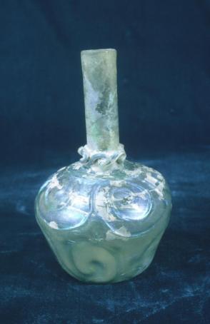 Long-necked, green glass bottle