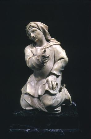Statuette of robed, kneeling figure