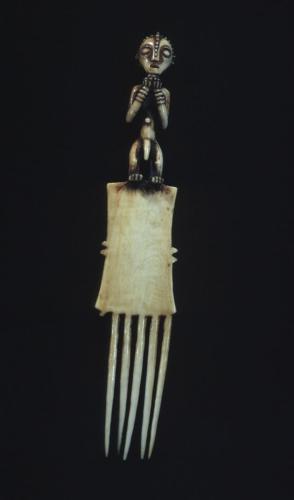 Comb with standing male figure