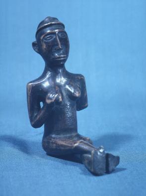 Seated female fetish figure