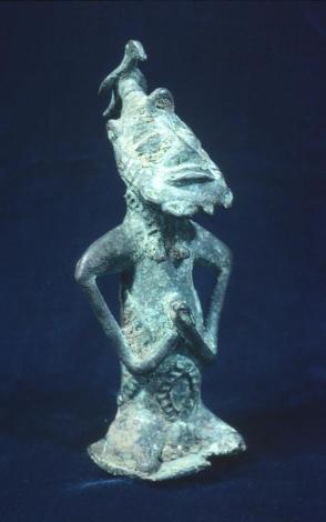 Kneeling figure with bird: (Onile)