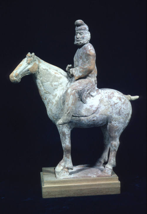 Foreign groom on horseback