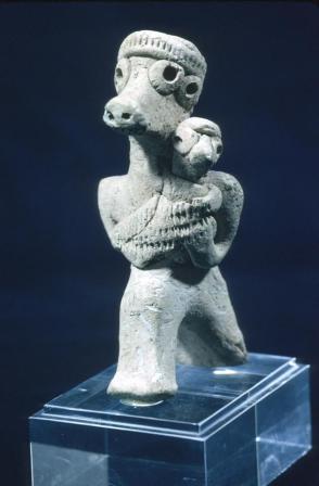 Mother and child; zoomorphic idol