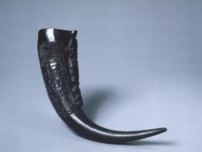 Drinking horn decorated with human figures in relief