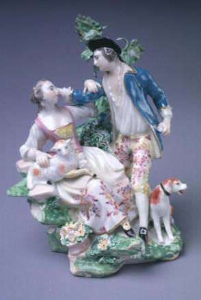Man with dog and woman with lamb