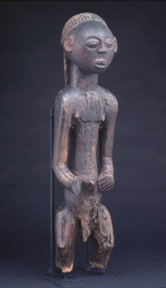 Male figure with balamwezi (the rising of the new moon) pattern